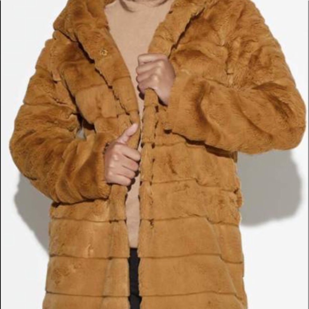 Never worn woman faux fur coat.